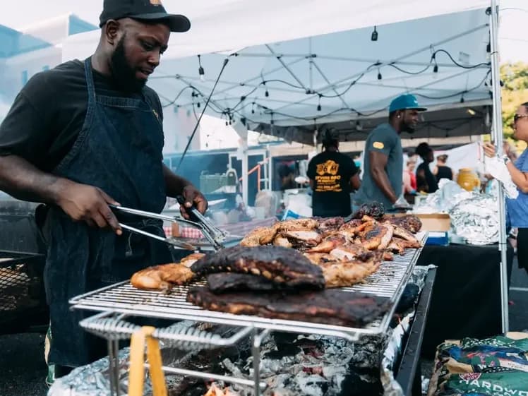 Pitmaster working the grill